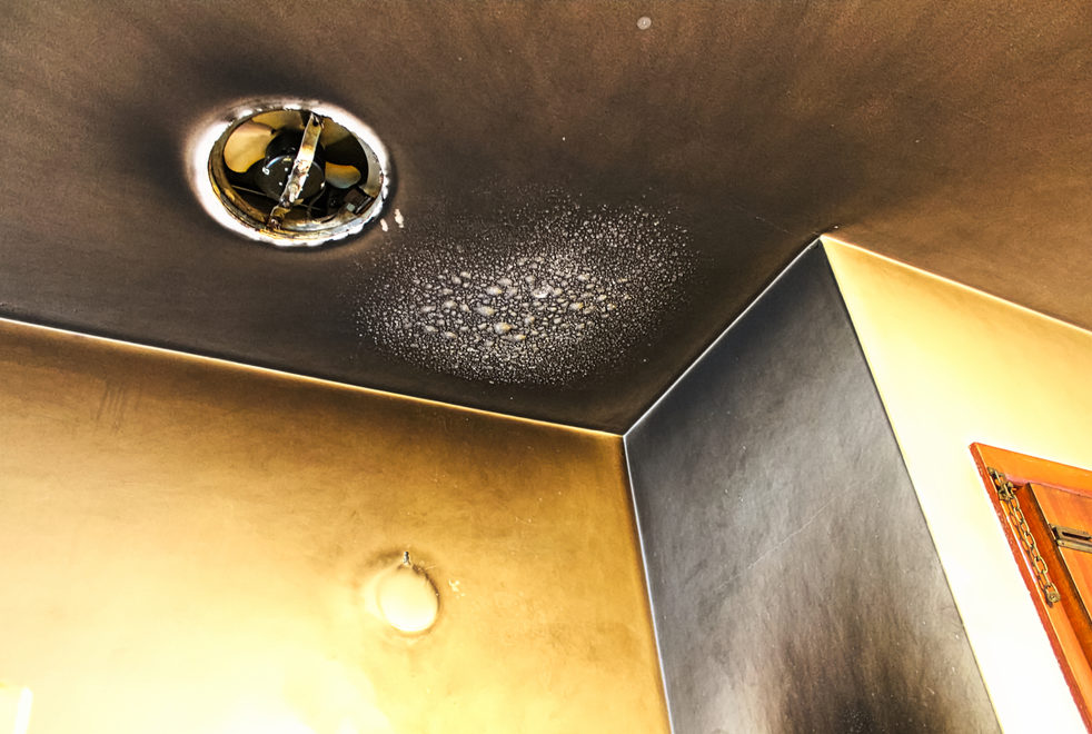 Professional smoke damage cleanup removing soot residue from affected area